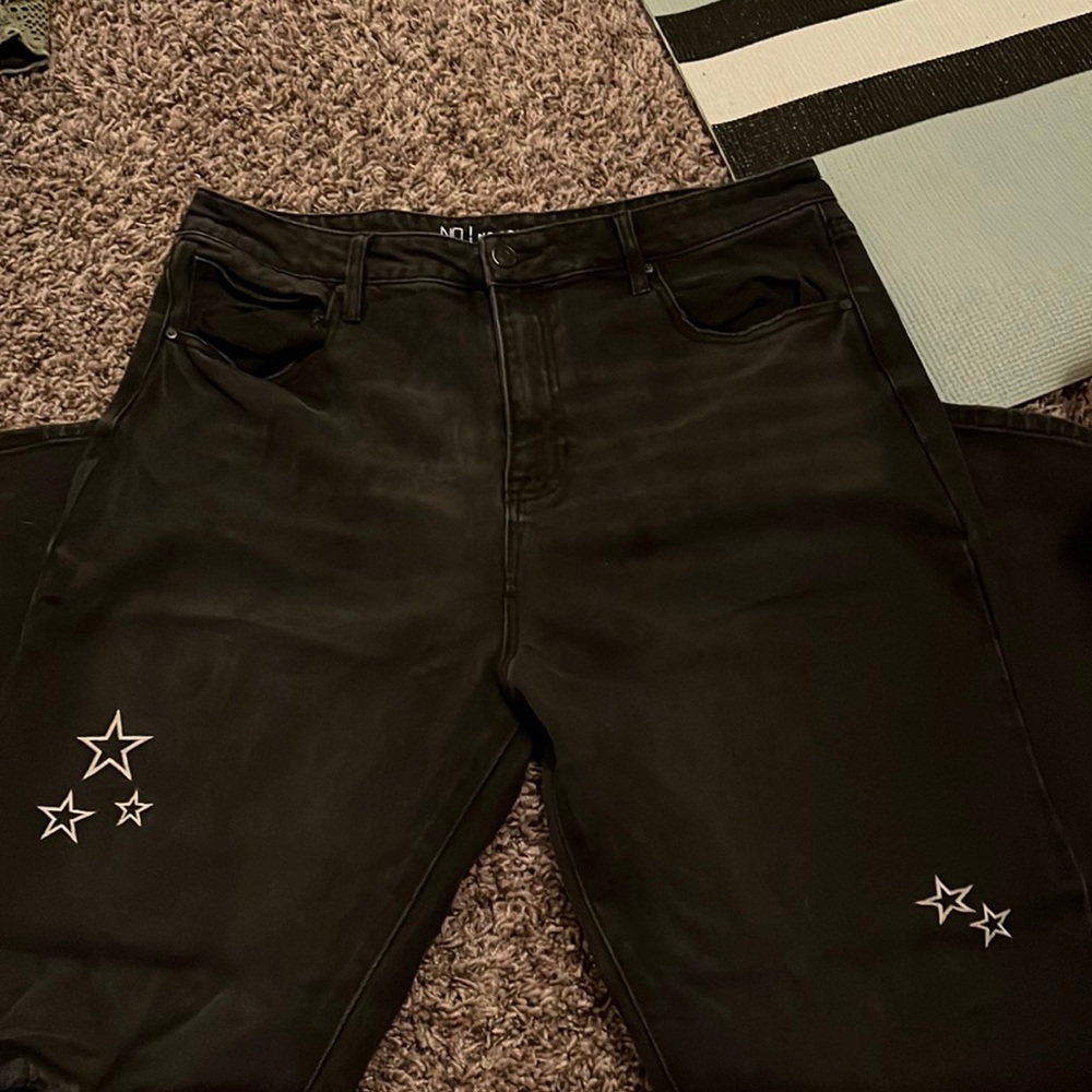 Black ripped knee jeans